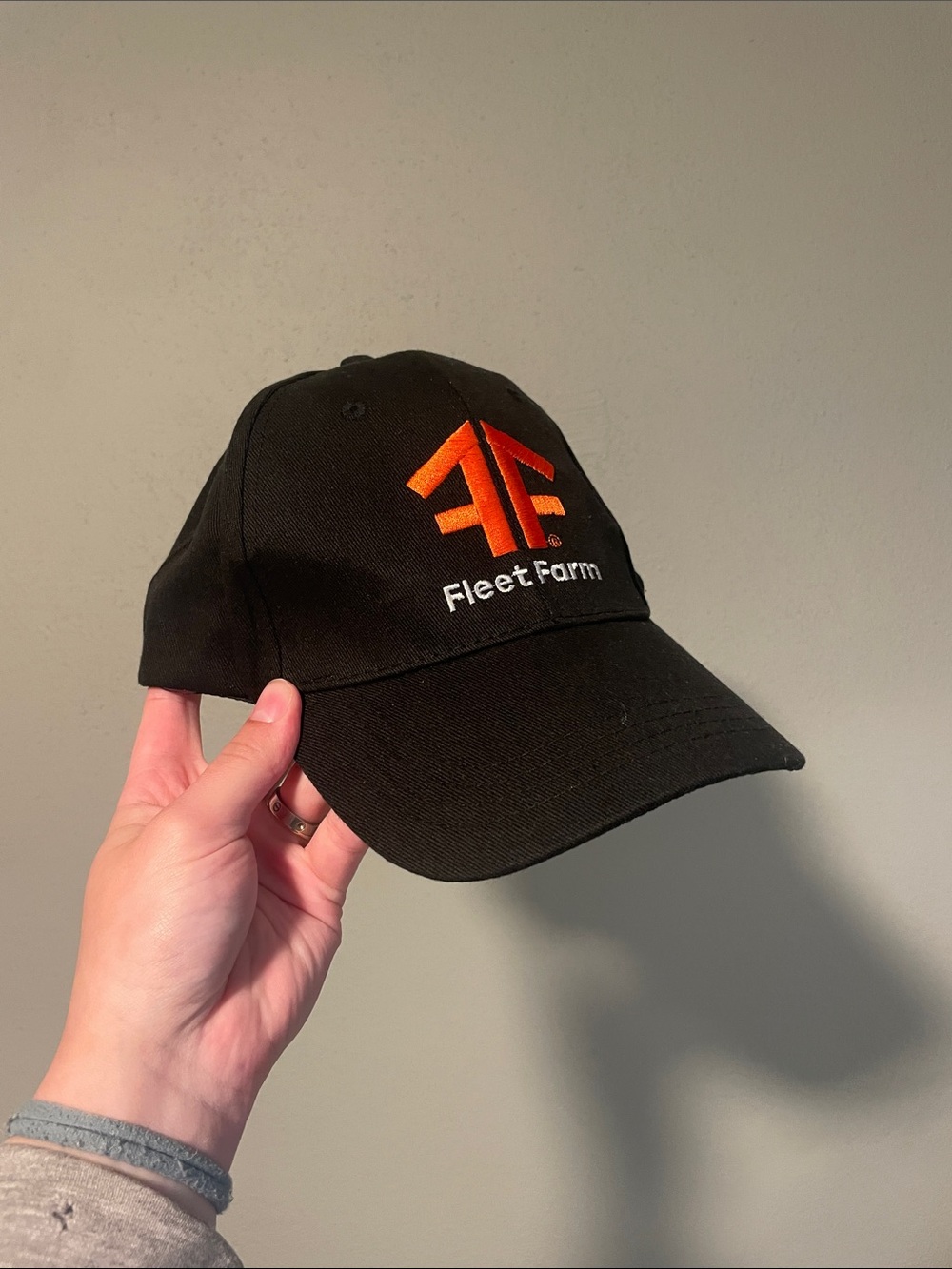 Fleet Farm Black Baseball Cap with Orange Logo